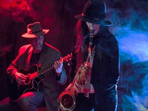Sax and guitar being played